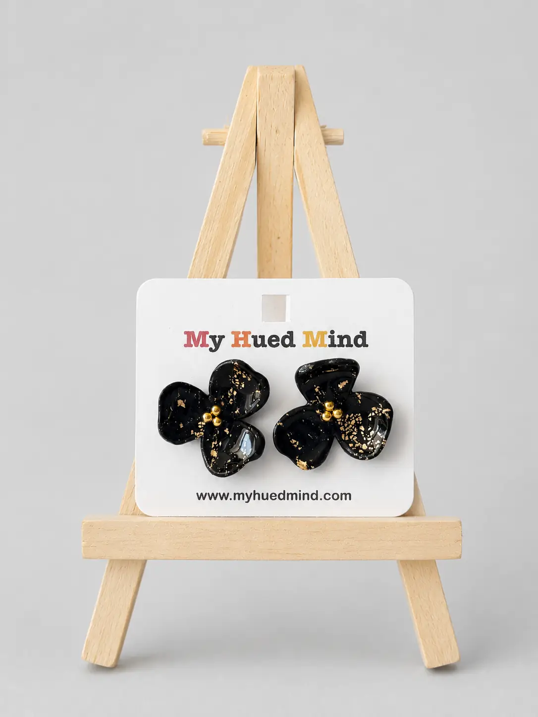 black-blossom-earrings-with-gold-leaf-details